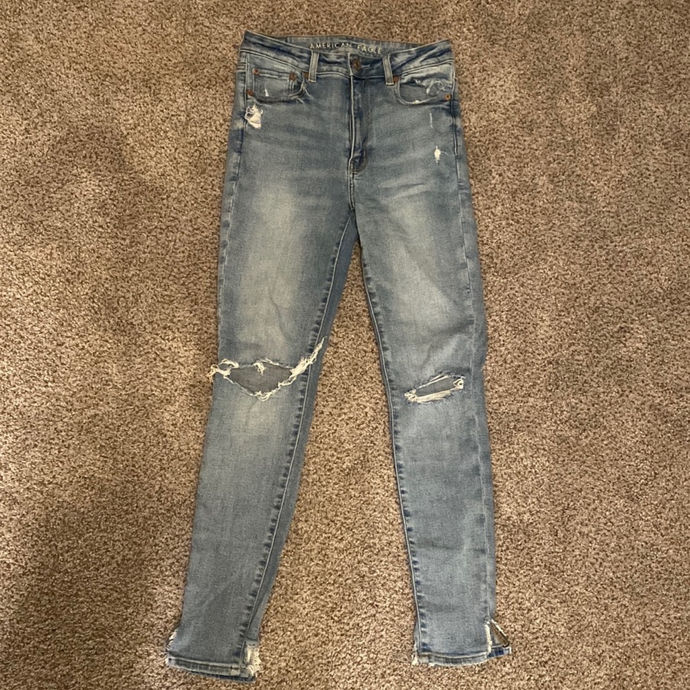 Size 6, SUPER STRETCH distressed light wash jeans.